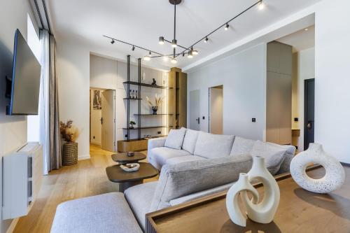 a living room with a couch and a table at Cavo Mare Skopelos in Skopelos Town