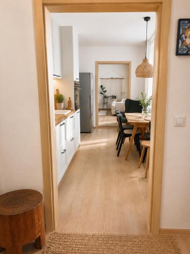 a kitchen and dining room with a dining table at Penzion Lederer in Dolní Dunajovice
