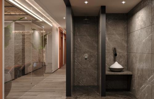 a bathroom with a shower with a bowl on a counter at Radisson Blu Residences, Istanbul Kartal in Istanbul