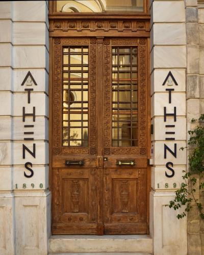 a wooden door on the side of a building at Athens 1890 Hotel & Spa in Athens