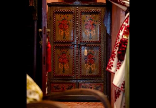 a wooden door with a design on it at Riad Rafeef in Essaouira