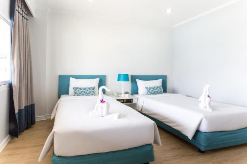Säng eller sängar i ett rum på Krabi Royal Hotel