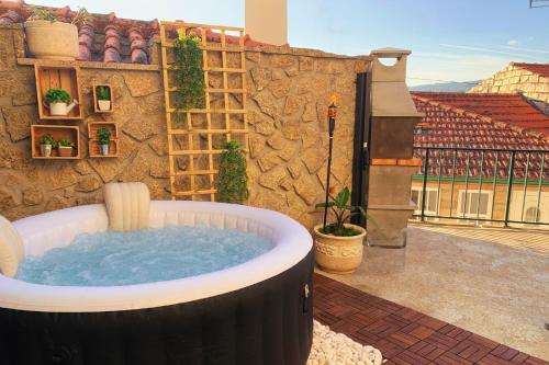 a jacuzzi tub sitting on a patio at Regouro - an Hidden Gem in Douro Valley in Boassas