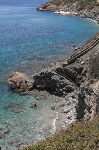 a view of a rocky shore with the ocean at Candia Lux in Heraklio