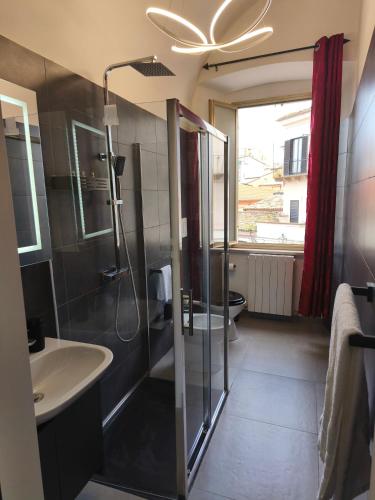 a bathroom with a shower and a sink at Agli Archi Eco House in Chieti