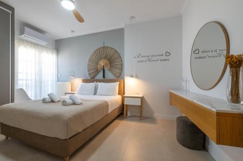 a bedroom with a bed and a mirror and a sink at A Comfortable Stay with Balcony and Easy Parking near Kalamata Center in Kalamata