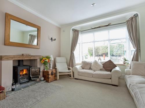 a living room with a couch and a fireplace at Stourcliffe House in Bournemouth