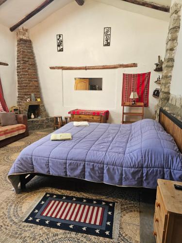a bedroom with a large bed in a room at Apu Ecolodge in Caraz
