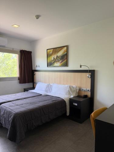 Llit o llits en una habitació de Hotel 170