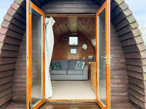 a small living room with a couch in a house at Woodpecker Hollow - Uk45980 in Ebchester