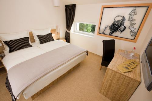 Postel nebo postele na pokoji v ubytování Ambient Hotel