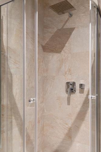 a shower stall with a glass shower door at Studio Rimini 523, Kotor in Kotor