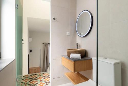 a bathroom with a sink and a mirror at Gioma Luxury Villas in Agios Nikolaos