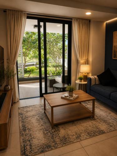 a living room with a couch and a coffee table at Luxury Coastal Escape Coral Point Sibaya Pool & WiFi in Durban