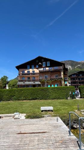 a large building with a bench in front of it at Seehaus Familie Leifer in St. Wolfgang