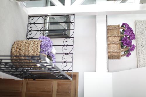 a walk in closet with purple flowers on the wall at Casa Rosa Gran Hotel Boutique in Puebla