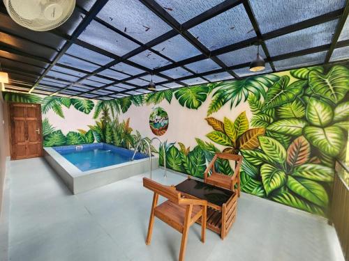 a mural of a swimming pool with a bench in a room at Diga vista resorts in Palakkad