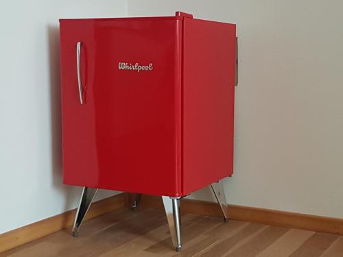 a red refrigerator with the words walmart on it at Apartamento Reyes Catolicos in Salta