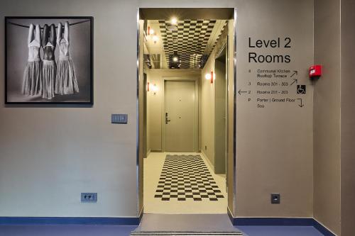 a hallway with a walkway leading to level rooms at Guest House Valea Morilor in Chişinău