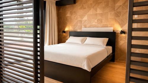 a bedroom with a large bed and a window at Antwerp Design Stay with Panoramic River Views in Antwerp