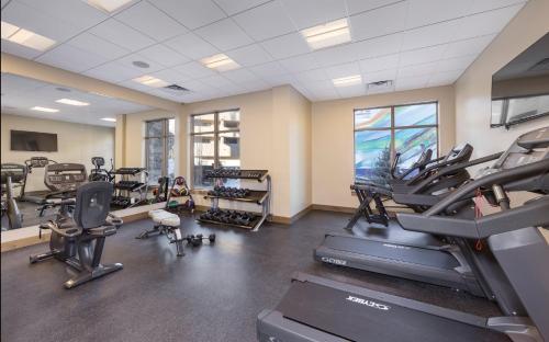 a gym with treadmills and ellipticals in a room at Avon Resort 2BR Suite in Avon