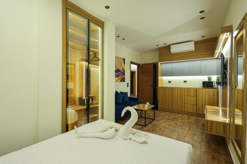 a hotel room with a bed with a swan on it at Elite Boutique Hotel in Cairo