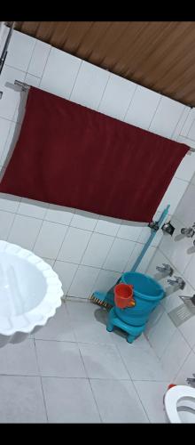 a bathroom with a blue toilet in a room at Hotel alpine resort pahalgam in Pahalgām