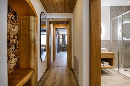 a hallway of a house with a wooden ceiling at Zillertaler Hofchalets Schustererhof in Stumm