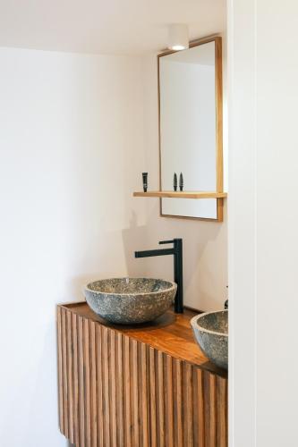 two sinks on a wooden counter in a bathroom at 3 Bedroom Villa with Lagoon View Pool in Marigot