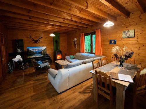 a living room with a couch and a table at Orla Chata Baltic House in Świnoujście