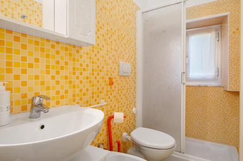 a bathroom with a sink and a toilet at Casa Mia in Rapallo