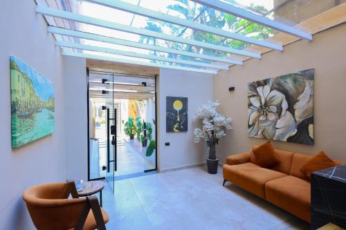 a living room with a couch and a ceiling at Elite Boutique Hotel in Cairo