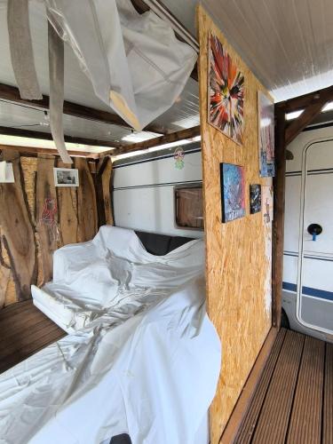 a bedroom with a bed in an rv at Large camper in the olive grove in Banjole