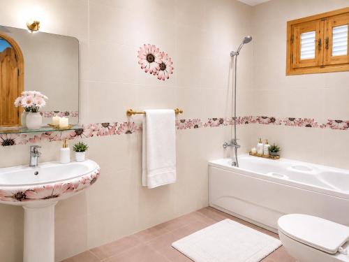 a bathroom with a sink and a tub and a toilet at Modern Villa in Dahab in Dahab