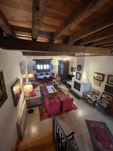 an overhead view of a living room with red furniture at La Fernandina in Riaza
