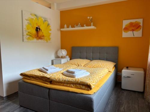 a bedroom with a bed with two towels on it at Apartment Adlerblick in Detmold