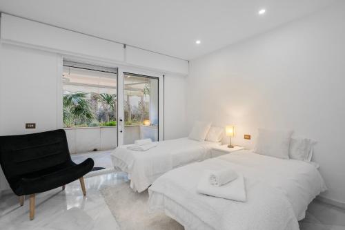 Luxury Beachfront Apt with Private Garden & Pool