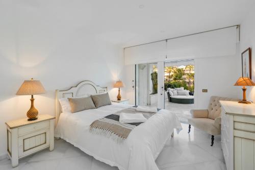 Luxury Beachfront Apt with Private Garden & Pool