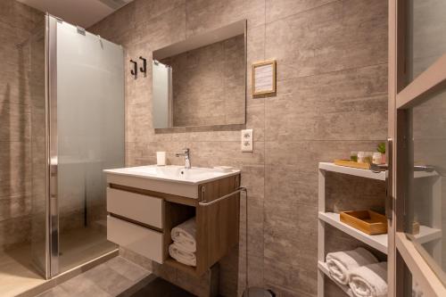 a bathroom with a sink and a shower at La CHARMILLE PADIRAC in Padirac
