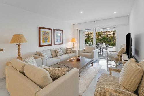 Luxury Beachfront Apt with Private Garden & Pool