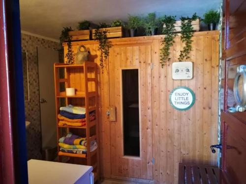 a room with a wooden wall with plants on it at Villa El Jagüel in Sauzal