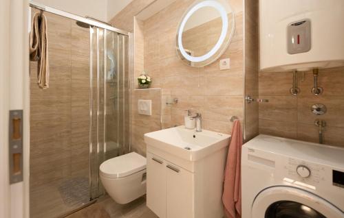a bathroom with a sink and a toilet and a shower at Apartment Avelina in Mošćenice