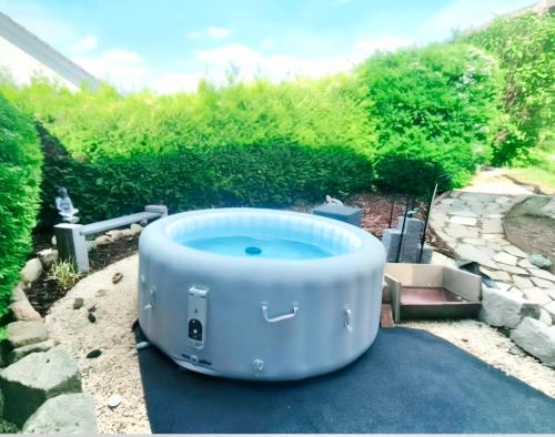 a large blue tub sitting on the ground in a yard at Ferienwohnung Merkurpanorama in Gernsbach