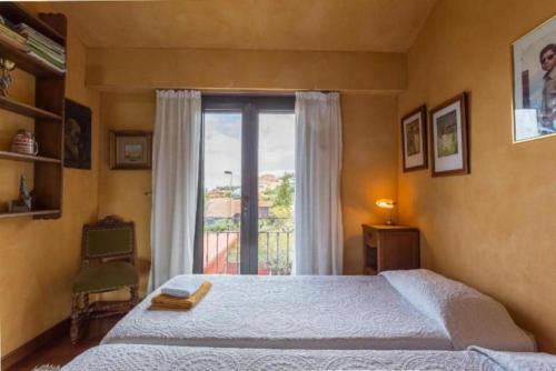 a bedroom with a large bed and a window at Villa El Jagüel in Sauzal