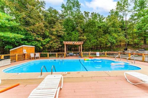 a large swimming pool with a gazebo at Glam Jam! - Newly Remodeled Stay in Style! Pets Stay Free in Branson