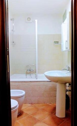 a bathroom with a shower and a sink and a toilet at Alloggio Turistico EDEN - Lubriano in Lubriano