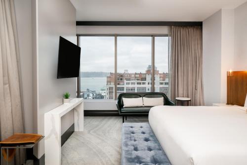 a hotel room with a bed and a large window at Hotel 1000, In The Unbound Collection By Hyatt in Seattle