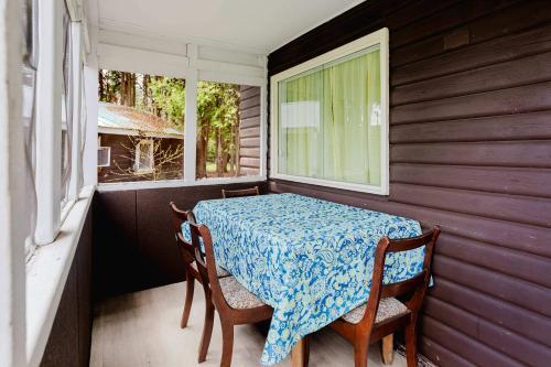 a table and chairs in a room with a window at 2-Bedroom Cottage #1 - Ambleside in Kawartha Lakes