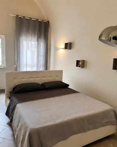 a bedroom with a large bed in a room at Dimora del tramonto in Trani