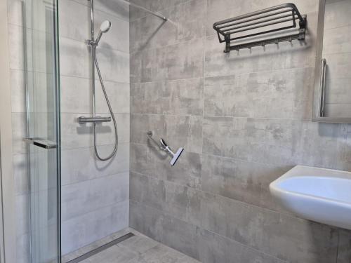 a bathroom with a shower and a sink at Apartment Natalija A2 ground floor in Krk